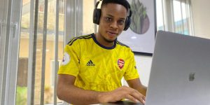 man in yellow and blue adidas crew neck t-shirt wearing black headphones